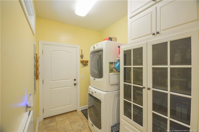 654 Titmouse Ct, Vass, NC 28394 - laundry room with estacked washer and dryer, french doors, and light stone finish flooring
