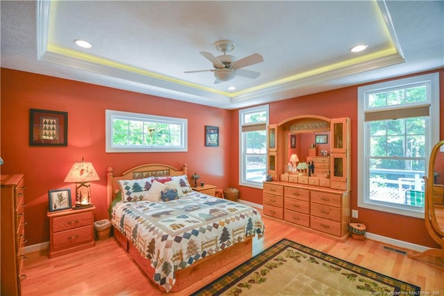 654 Titmouse Ct, Vass, NC 28394 - bedroom with a raised ceiling, light wood-style floors, ornamental molding, and recessed lighting