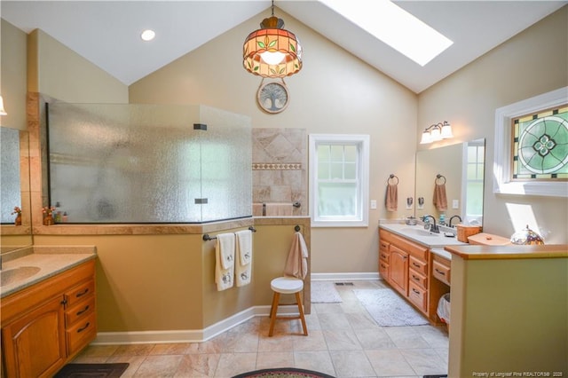 654 Titmouse Ct, Vass, NC 28394 - bathroom featuring a skylight, vanity, walk in shower, and high vaulted ceiling