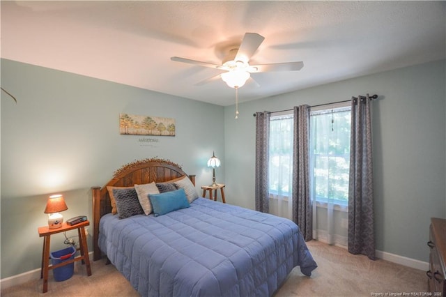 654 Titmouse Ct, Vass, NC 28394 - bedroom with light colored carpet and a ceiling fan