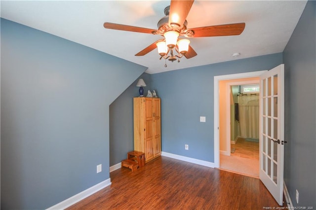 654 Titmouse Ct, Vass, NC 28394 - unfurnished bedroom with wood finished floors, ceiling fan, french doors, and lofted ceiling