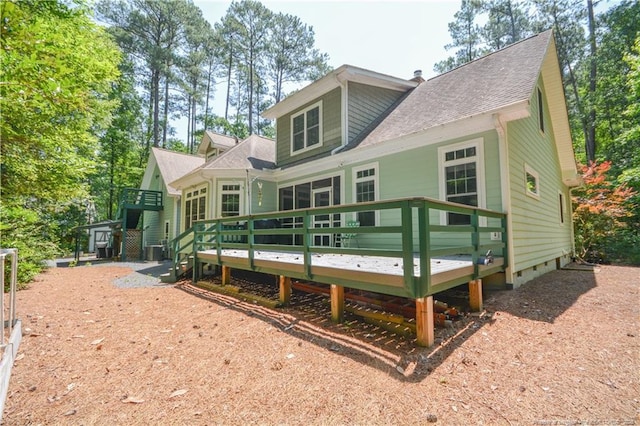 654 Titmouse Ct, Vass, NC 28394 - rear view of house with a wooden deck, a shingled roof, crawl space, and a chimney