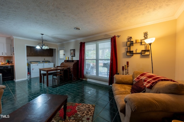 living room with washer and dryer, ornamental molding, a textured ceiling, and a notable chandelier