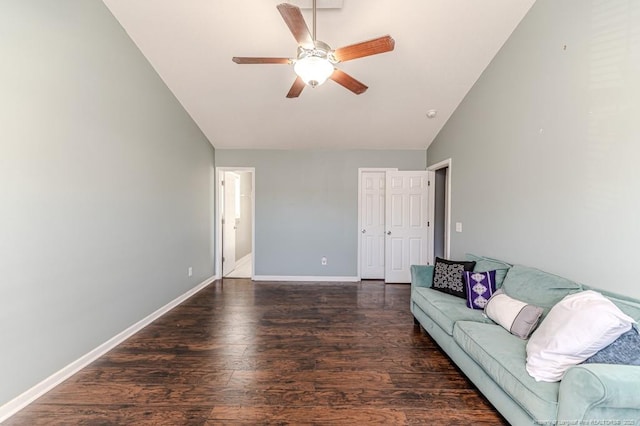 living room with dark hardwood / wood-style floors, ceiling fan, and lofted ceiling