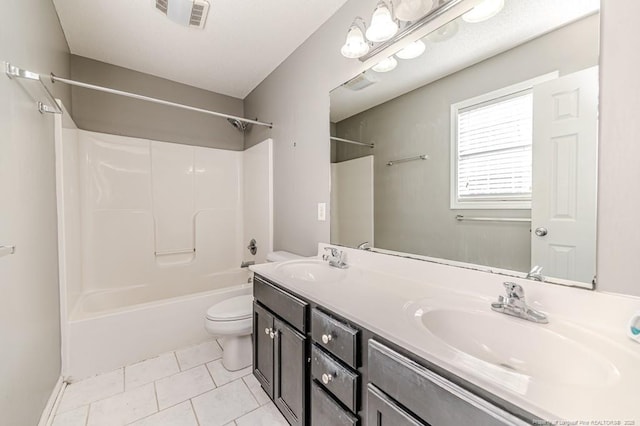 full bathroom featuring tile patterned floors, toilet, vanity, and tub / shower combination