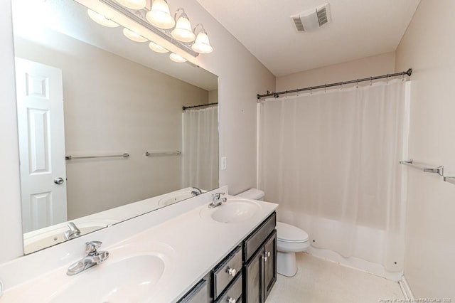 bathroom with vanity, toilet, and curtained shower