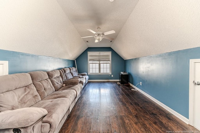 living room featuring dark hardwood / wood-style floors, ceiling fan, a textured ceiling, and vaulted ceiling