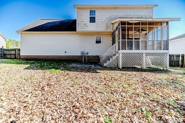 back of house featuring a sunroom