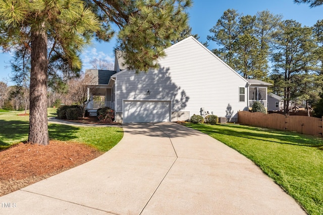 view of property exterior featuring a lawn, a garage, and a porch