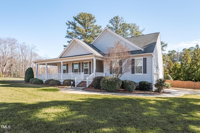 view of front of house with a front yard and covered porch