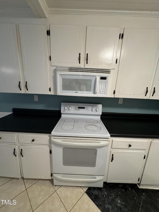 kitchen featuring white cabinets, light tile patterned flooring, white appliances, and crown molding