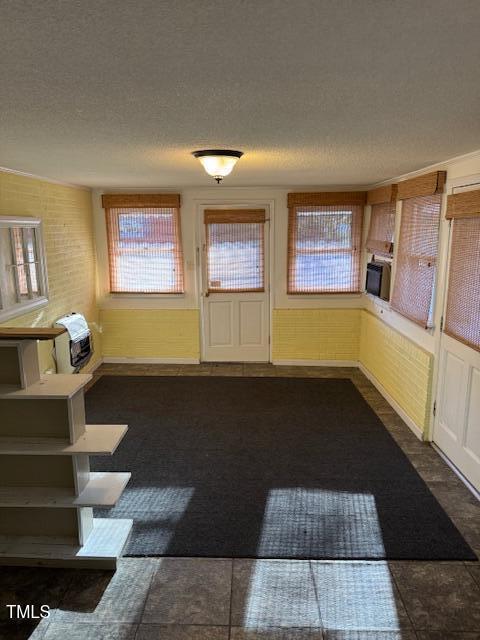 entrance foyer with a textured ceiling