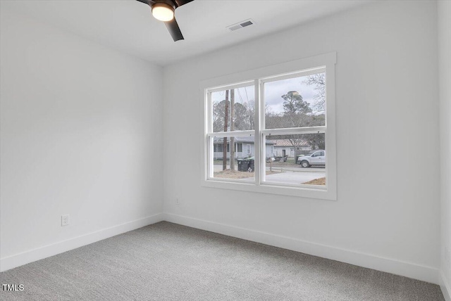 empty room with carpet and ceiling fan