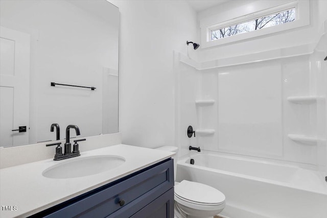 full bathroom featuring bathtub / shower combination, vanity, and toilet