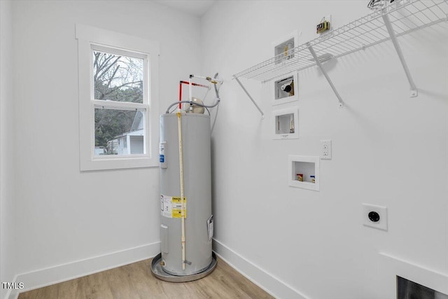 washroom featuring hookup for an electric dryer, washer hookup, electric water heater, and wood-type flooring