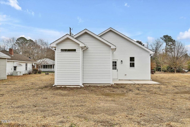 back of property with a patio