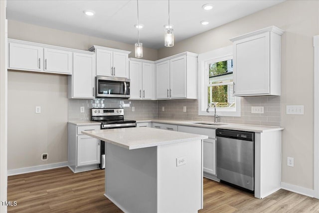 kitchen featuring white cabinets, sink, and appliances with stainless steel finishes