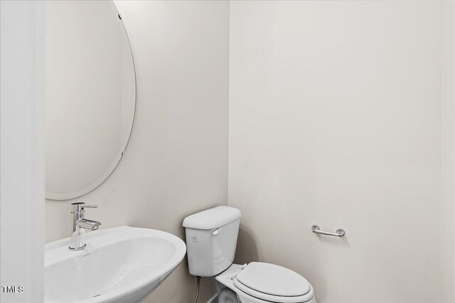 bathroom with toilet and sink