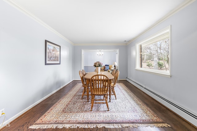 dining room featuring a baseboard heating unit, crown molding, dark hardwood / wood-style floors, and a chandelier