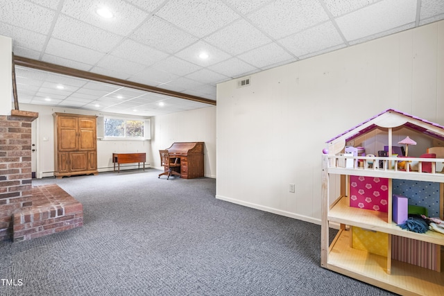 rec room featuring a paneled ceiling, carpet flooring, and a baseboard radiator