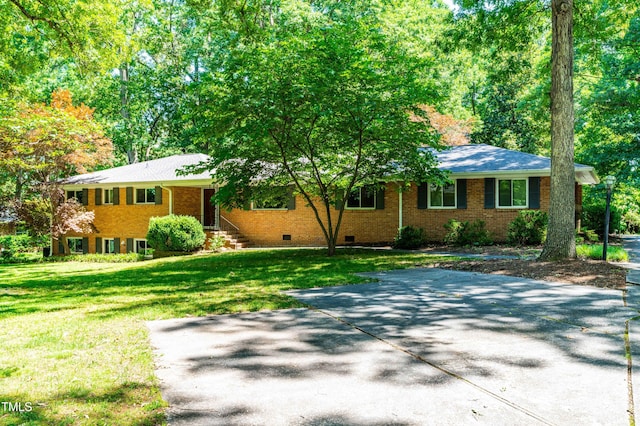5205 Rembert Dr, Raleigh, NC 27612 - ranch-style house with crawl space, a front yard, and brick siding