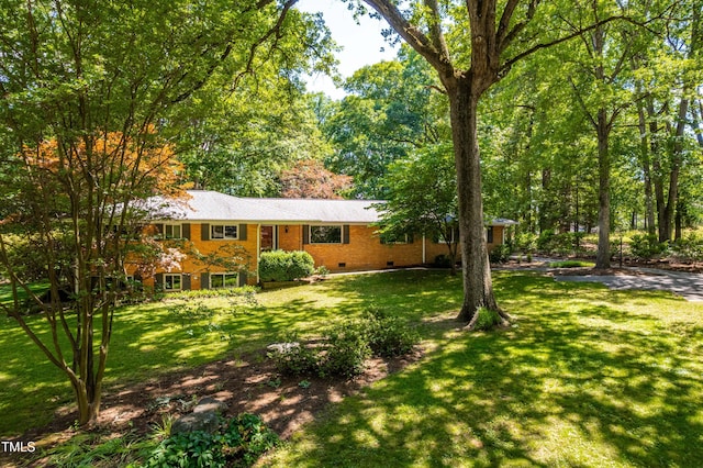 5205 Rembert Dr, Raleigh, NC 27612 - ranch-style house featuring crawl space, a front yard, and brick siding