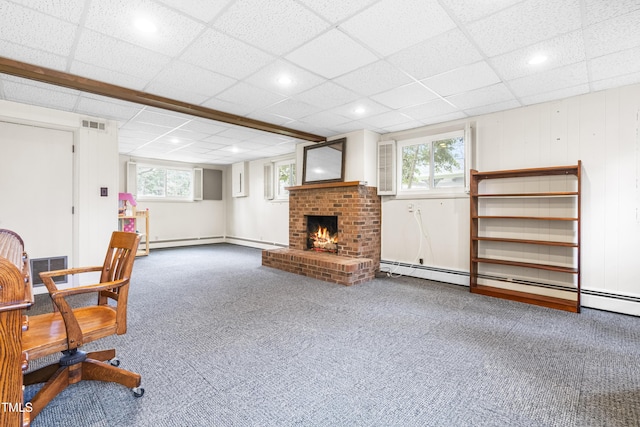 5205 Rembert Dr, Raleigh, NC 27612 - carpeted home office with a fireplace, plenty of natural light, a drop ceiling, baseboard heating, and recessed lighting