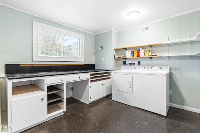 5205 Rembert Dr, Raleigh, NC 27612 - laundry room featuring washer and dryer, dark floors, and ornamental molding