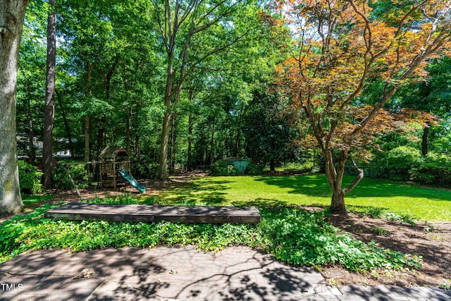 5205 Rembert Dr, Raleigh, NC 27612 - view of grassy yard with a playground