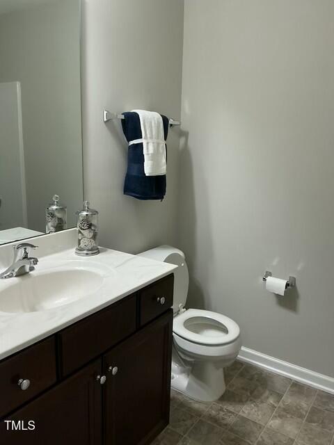 bathroom with vanity and toilet