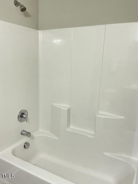 bathroom with shower / bathing tub combination