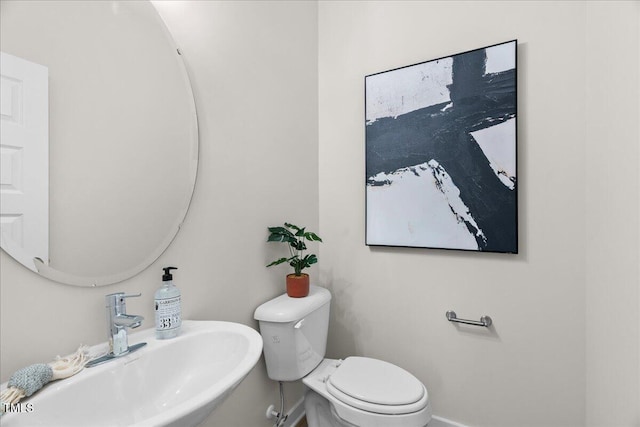 bathroom with toilet and sink