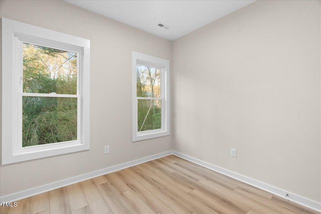 empty room with light wood-type flooring