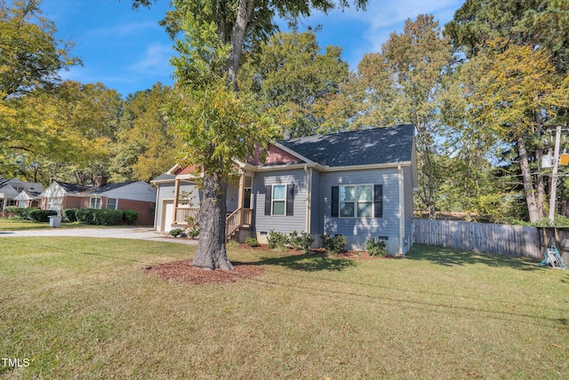 view of front facade with a garage and a front lawn