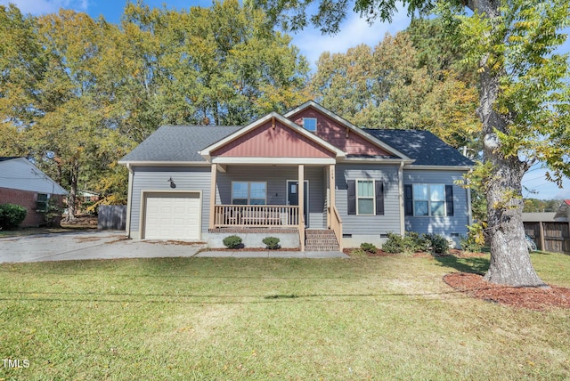 craftsman inspired home featuring a porch, a garage, and a front lawn