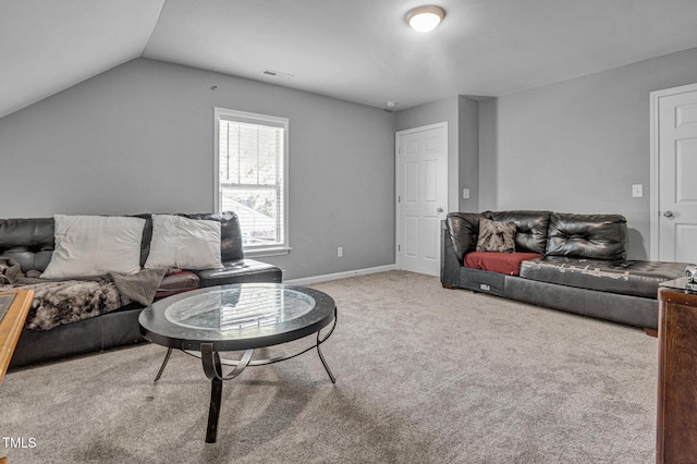 carpeted living room featuring lofted ceiling