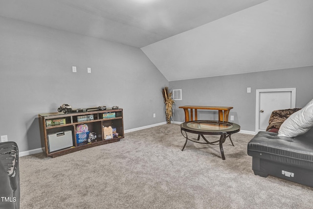 sitting room featuring carpet flooring and lofted ceiling