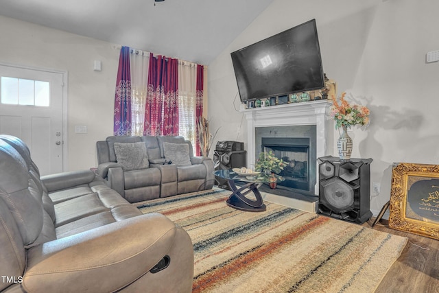 living room with hardwood / wood-style floors and vaulted ceiling