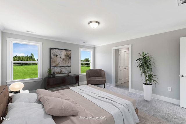 bedroom featuring crown molding and light carpet