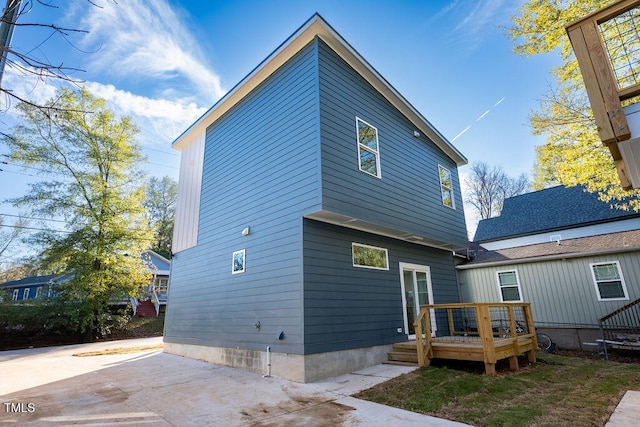 back of property featuring a deck