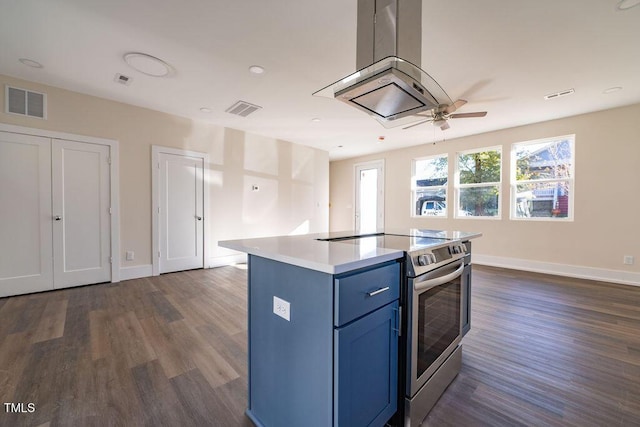 kitchen featuring a center island, blue cabinets, stainless steel electric range oven, dark hardwood / wood-style flooring, and island exhaust hood