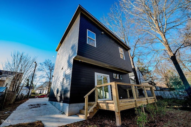 rear view of property with a deck