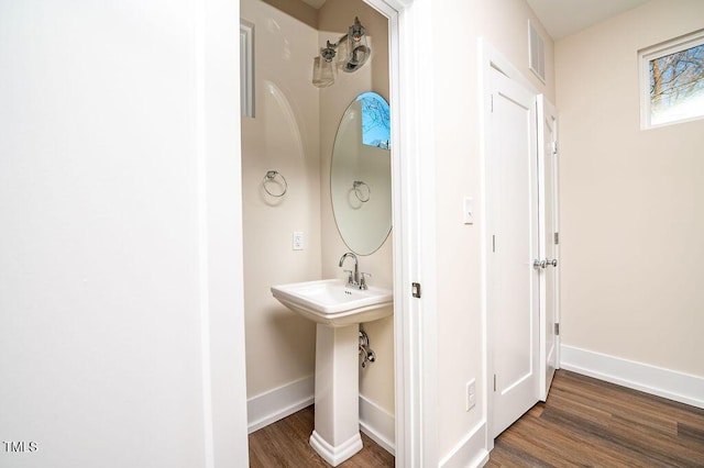 bathroom with sink and wood-type flooring