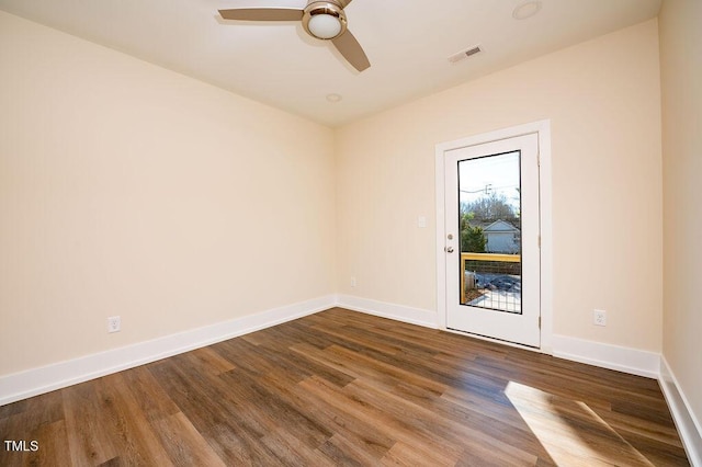 empty room with hardwood / wood-style flooring and ceiling fan