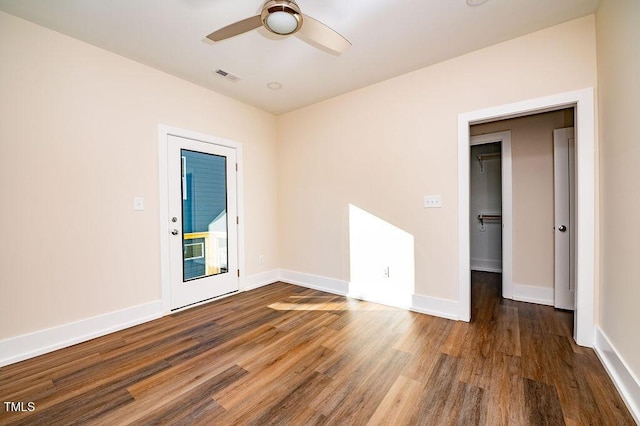 empty room featuring ceiling fan and wood-type flooring