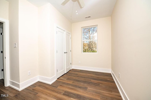 interior space featuring ceiling fan and dark hardwood / wood-style flooring