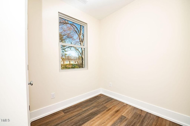 unfurnished room featuring wood-type flooring