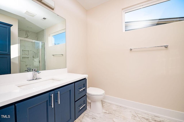 bathroom featuring walk in shower, vanity, and toilet