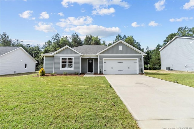 view of front of property featuring a garage and a front lawn