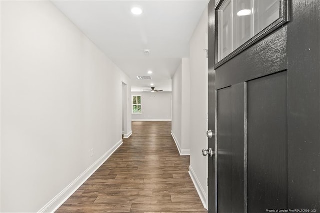 corridor featuring hardwood / wood-style floors